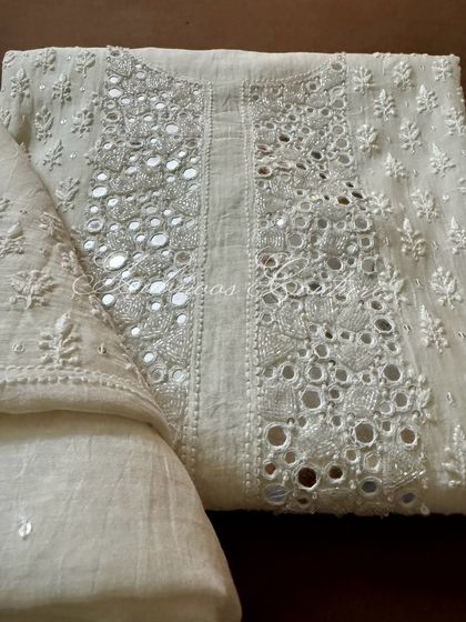 A folded view of the kurta, perfect for appreciating the texture and craftsmanship of the mirrorwork.