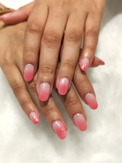 A full view of the perfect pink ombre set, a testament to subtle and clean nail art.