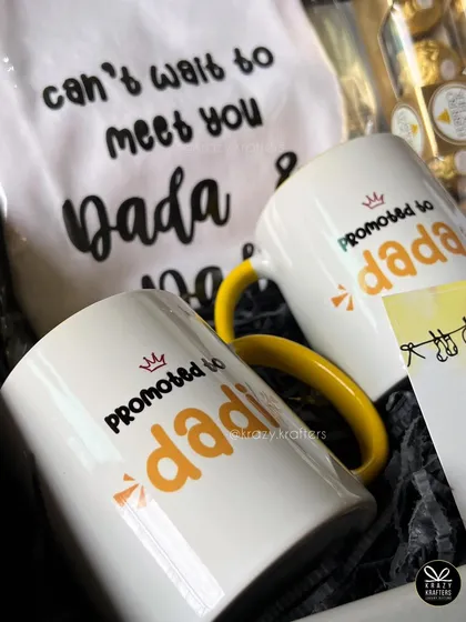 "Promoted to Dada & Dadi!" These custom mugs and a matching onesie are a fantastic way to surprise the new grandparents and give them a keepsake to cherish.