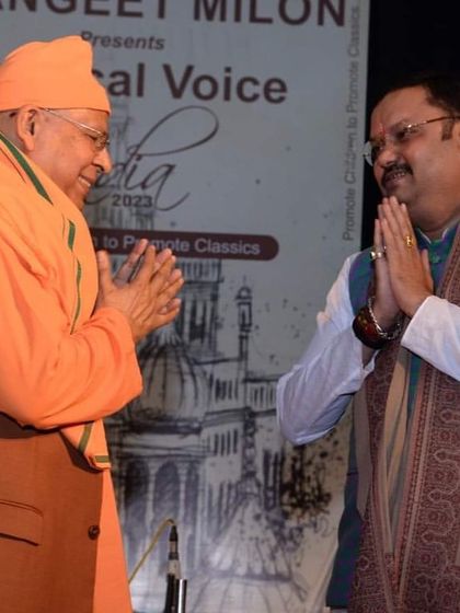 A moment of mutual respect with a senior musician at the Sangeet Milon event. It is always an honor to be in the company of such great artists.
