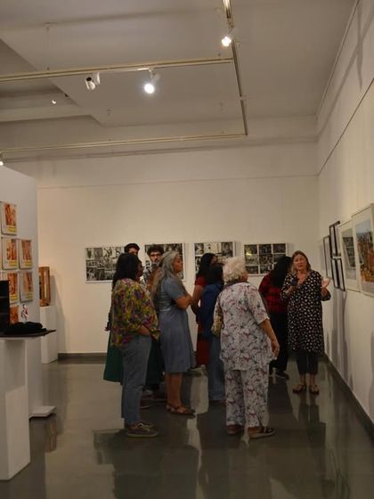 The group gathered around the main gallery space during the walkthrough of 'Southern Stars'.