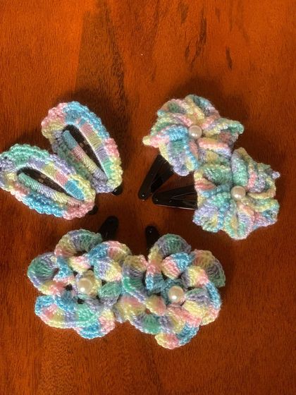For a softer look, I offer these floral hair clips in dreamy pastel rainbow colors. They are a sweet and gentle accessory for any occasion.