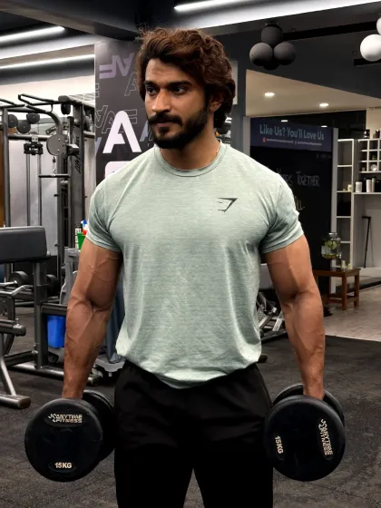 Beast mode, all day, every day. Holding heavy dumbbells, ready for the next set. The mindset you bring to the gym determines your results.