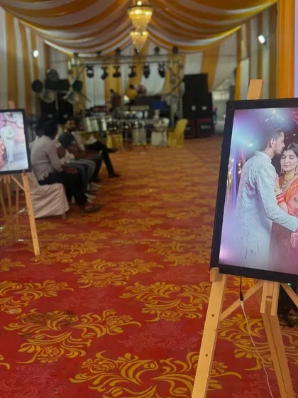 A closer look at the personalized photo displays we use to decorate the entrance. These framed pictures on easels are a wonderful way to share the couple's journey with their guests.