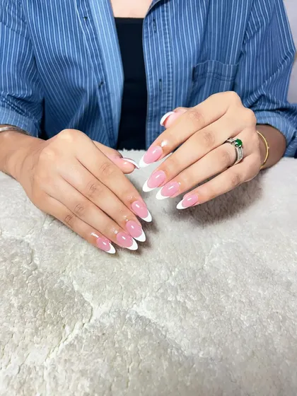 The classic French manicure is timeless for a reason. It requires precision and a steady hand, which are foundational skills I emphasize in my training. Learning to perfect this look ensures you can meet the demands of any client.