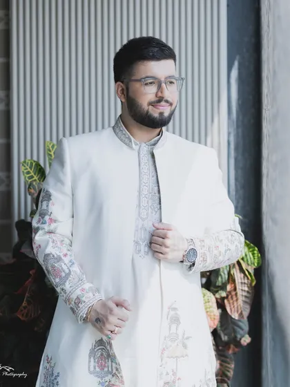 This groom's style is all about looking sharp and feeling great. The makeup is subtle but effective, evening out the skin tone and ensuring he is ready for professional photography.