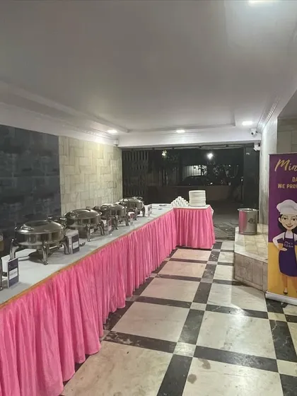 A full view of a society gathering buffet, including my professional standee. I bring a complete and branded setup to every event.
