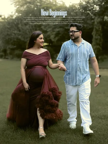 An outdoor session allows us to capture love in its most natural form. Here, an expecting couple shares a quiet moment while walking through a park, the flowing gown adding a touch of romance to the serene landscape.