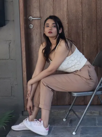 A seated portrait on a chair, giving the casual look a slightly more structured feel.