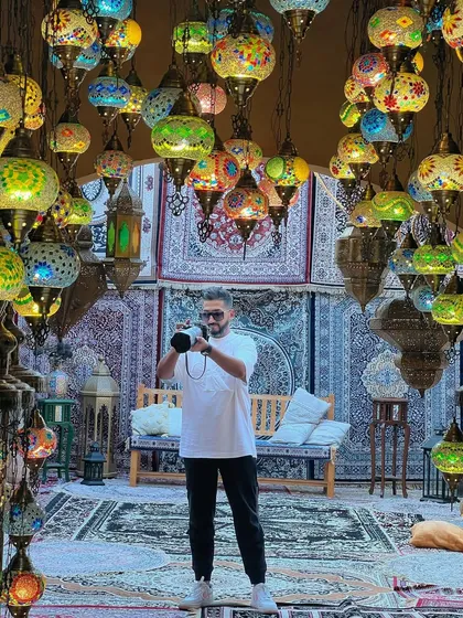 In a room full of Turkish lamps, a location that provides incredible light and color for portraits.
