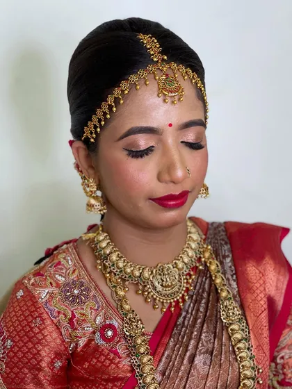 A close-up of the eye makeup, showing a soft, blended look with a sharp liner that makes the eyes stand out.