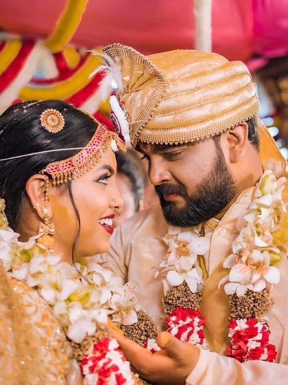 A candid moment filled with love. My bridal makeup was soft yet defined, ensuring it looked beautiful in professionally captured, emotional moments like this.