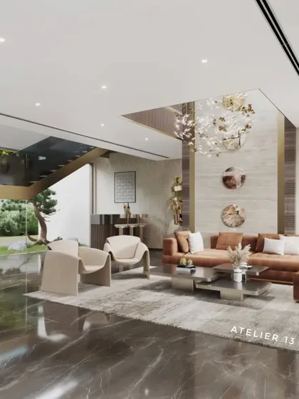 This view of the farmhouse lounge highlights the architectural details, including the clean lines of the ceiling and the seamless integration of the staircase. The polished marble floor reflects the natural light, enhancing the sense of space and luxury.