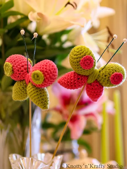 A close-up of the Happy Butterflies. You can see the detailed stitching and the little pearl-tipped antennae that give them their charming character.