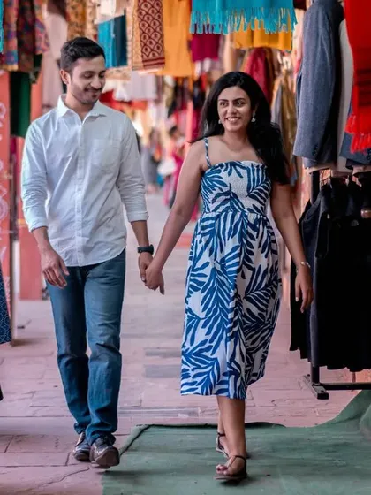 Exploring the colorful lanes of a local market. This candid shot captures the joy of discovery and the feeling of being on an adventure together.