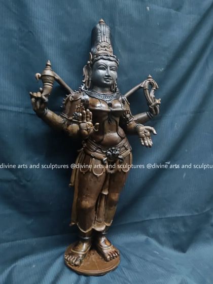 The wax model of goddess Bhuvaneswari, a representation of the entire cosmos. Her standing posture and hand gestures are defined in this crucial first stage.