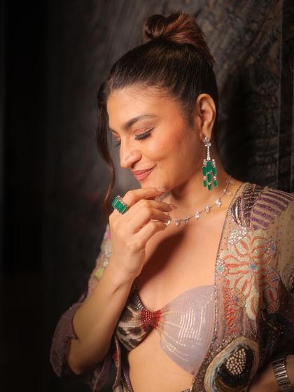 A close-up that captures the ethereal glow of this makeup. The skin is flawless, and the soft glam enhances her features from every angle.