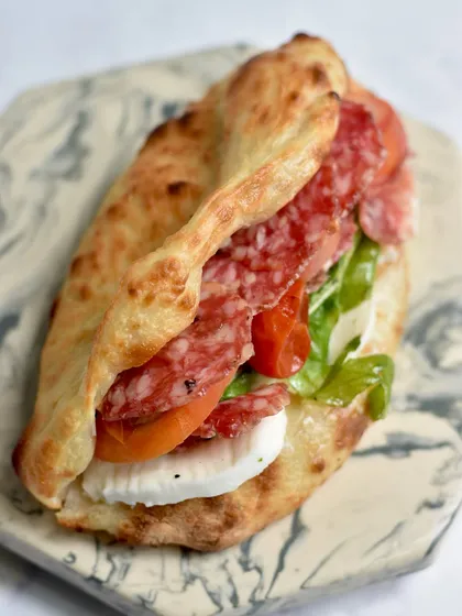 A closer look at our savory side. This Sourdough Pizza Sandwich is layered with premium Ibérico sausage, fresh mozzarella, and roasted tomatoes. It's a perfect example of how we bring our bakery expertise to delicious, satisfying savory creations.