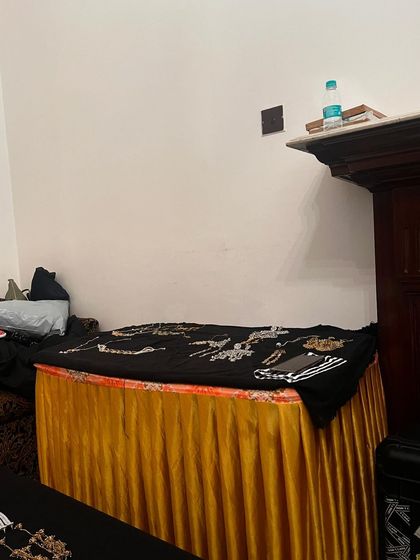 A table laden with jewelry for the shoot. Protecting the intellectual property of accessory designers is a key part of my work.