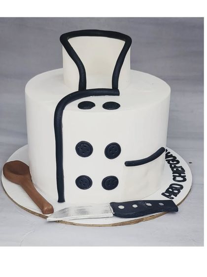 A cake designed to look like a chef's uniform. This chocolate truffle indulgence cake is a perfect tribute for a professional chef's birthday.