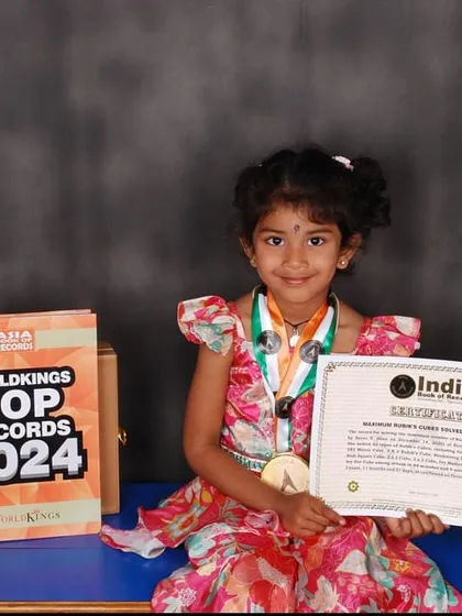 We celebrate every child's unique talents. We are incredibly proud of our student, Aarna N, who set a record with the India Book of Records and Asia Book of Records for solving 53 types of Rubik's Cubes at just three years old.