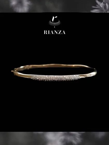 A slightly different angle of the curved daily wear bracelet, showing its delicate sparkle.