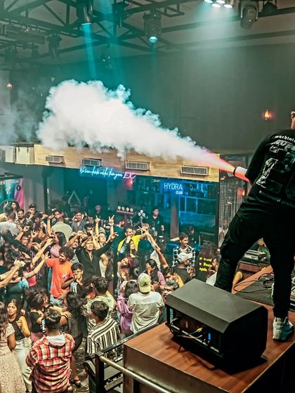 A side view of the CO2 cannon in action, showing the power and spread of the smoke effect that enhances the drop.