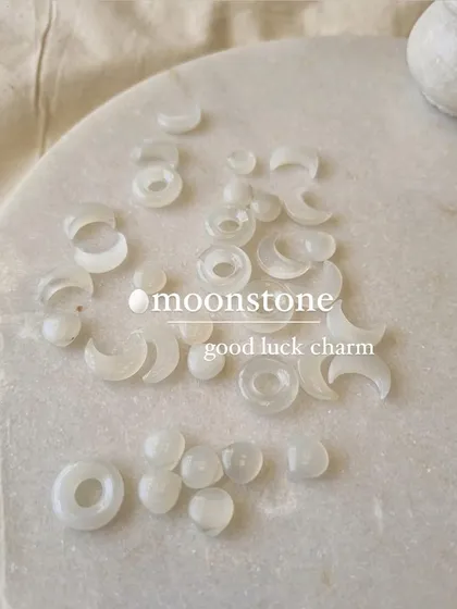 Raw white moonstone charms, which I consider excellent good luck charms. This stone is wonderful for attracting good fortune in love and business.
