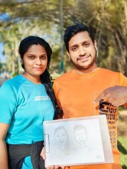 Here's a lovely couple posing with their caricature on a sunny day in the park. A perfect, spontaneous souvenir.