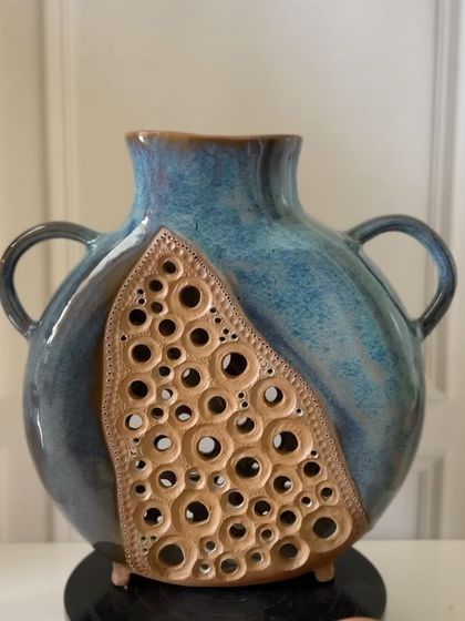 A slightly different angle of the large, slab-built vase with pierced details. It’s a perfect example of how hand-building allows for complex and organic forms.