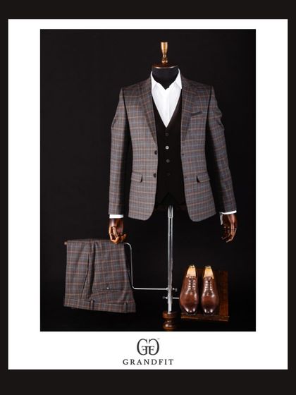 A handsome brown and blue plaid three-piece suit. The earthy tones are sophisticated and offer a refreshing alternative to traditional navy and grey.