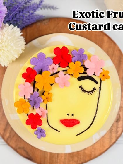 Our Exotic Fruit Custard cake, specially designed for Women's Day, features a light custard base and is decorated with colorful, edible flowers.