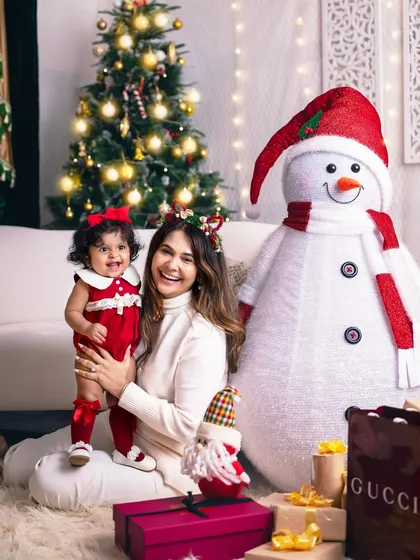 "Christmas isn't a season, it's a feeling." A mother and daughter share a joyful moment in our festive studio.