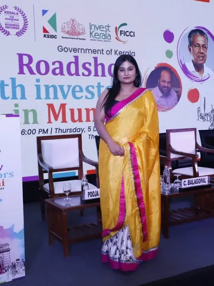 Posing on the stage set for the Invest Kerala Global Summit roadshow. I am trusted to host high-profile government and investor events.