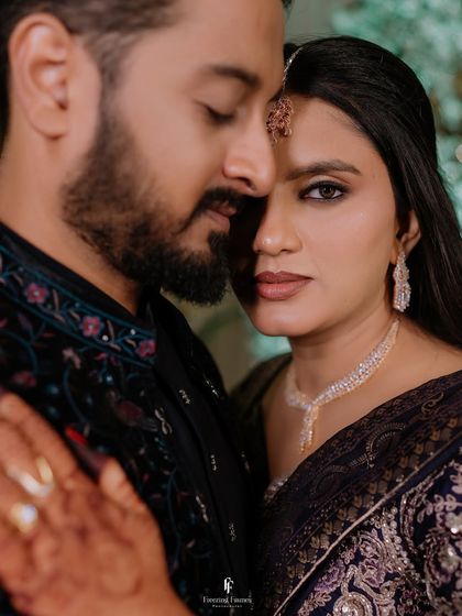 A close-up, intimate portrait of the couple, highlighting their connection and the bride's stunning makeup.