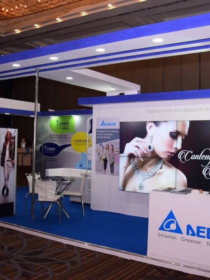 A custom-fabricated exhibition stall for a corporate client. The design is clean and professional, with clear branding, product displays, and a welcoming meeting area to attract and engage visitors.