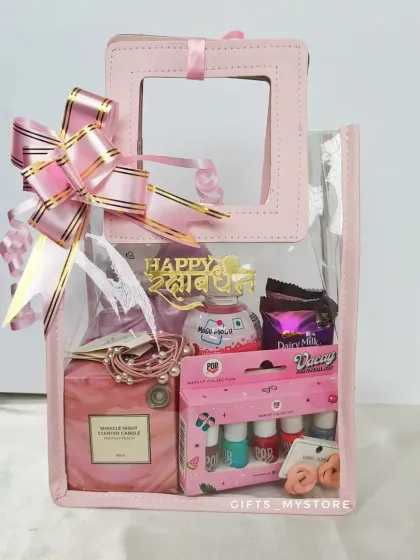 A matching pink hamper for your sister, including a scented candle, nail polish set, and other cute goodies.