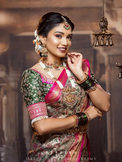 I love finding pieces that are a little different, like this gorgeous floral brocade saree. Paired with an embroidered green blouse and a pop of pink, it’s a fresh and romantic option for a modern bride.
