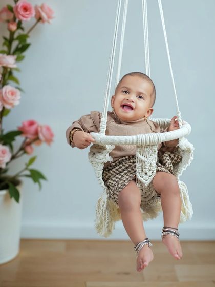 The biggest, happiest smile from our sitter session. The joy on this baby's face is what it's all about. These sessions are full of giggles and adorable expressions.