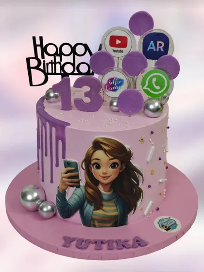 A trendy cake for a 13th birthday, reflecting a teenager's world of selfies and social media apps like YouTube and WhatsApp.