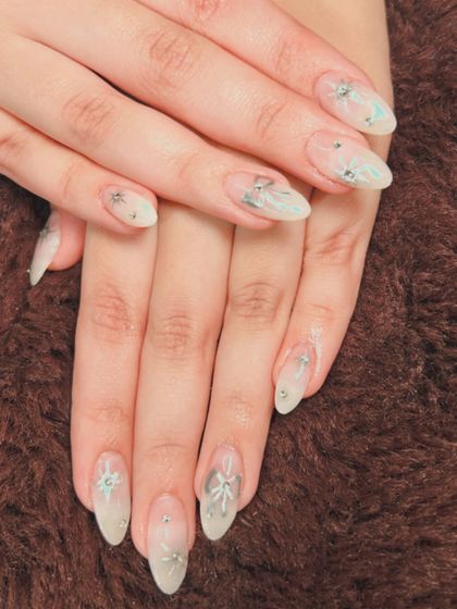 A frosty and elegant set with a sheer base, silver embellishments, and star details.