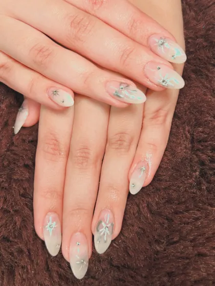A frosty and elegant set with a sheer base, silver embellishments, and star details.