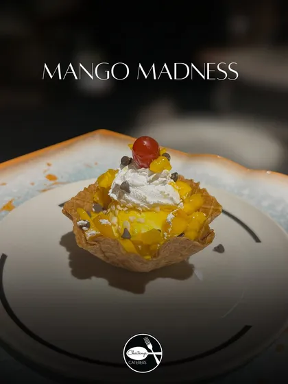 My Mango Waffle Mania is a celebration of the king of fruits. A crispy waffle bowl is filled with mango ice cream, fresh mango chunks, whipped cream, and chocolate chips for a delightful crunch.