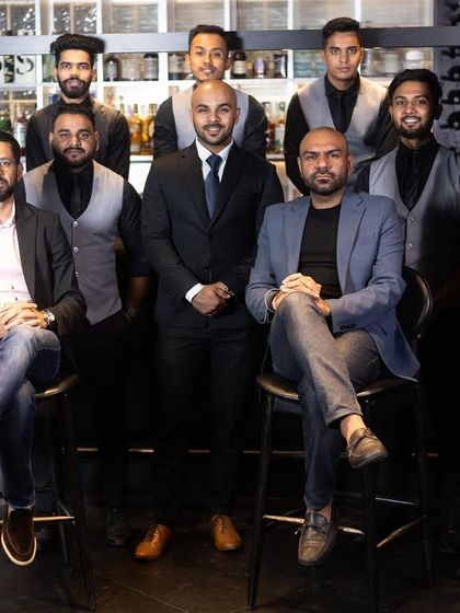 Crafting the perfect cocktail, one sip at a time. Our expert mixologists, the heart and soul of Lair, pose for a team photo at the bar.