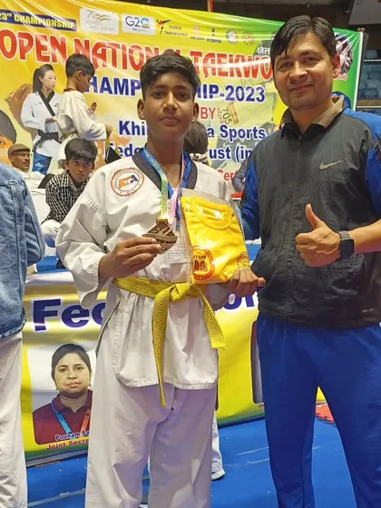 A student with his bronze medal from the Open National Taekwondo Championship.
