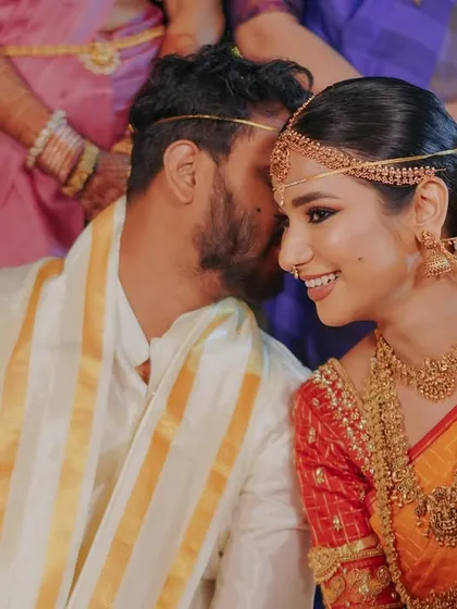 The pure joy of a South Indian wedding. My bride Vaishnavi looked absolutely magical in her traditional saree. I focused on creating a luminous base and classic eye makeup to complement her intricate gold jewelry and the richness of the ceremony.