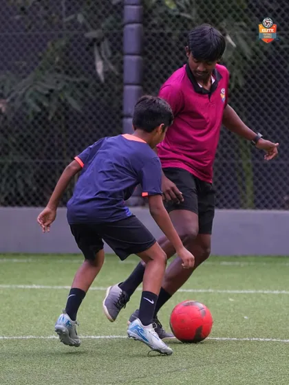 Close-up coaching in action. We work on every detail to help our players master the fundamentals of the game.
