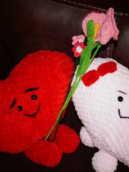 A romantic scene with my two heart plushies sharing a bouquet of flowers. Perfect for celebrating love.