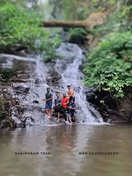 Our trekkers enjoying a refreshing break at a waterfall in Kasargod during the Ranipuram peak adventure.
