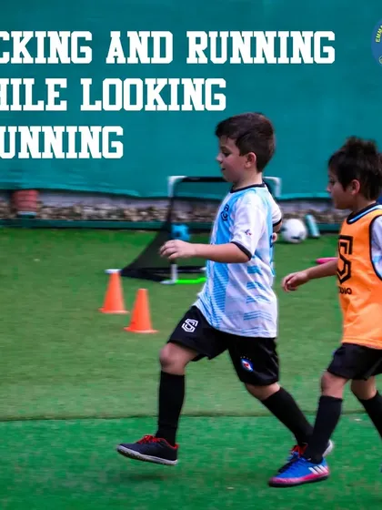 Two young players run side-by-side during a training session. Our programs emphasize agility, speed, and teamwork, building well-rounded athletes on and off the ball.